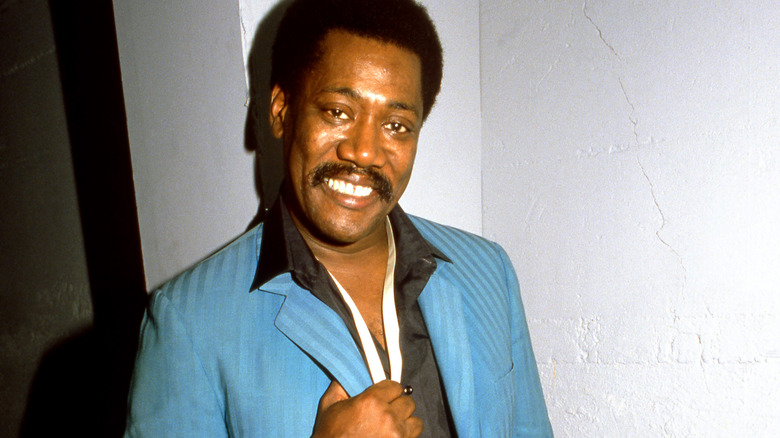 Clarence Clemons wears a suit