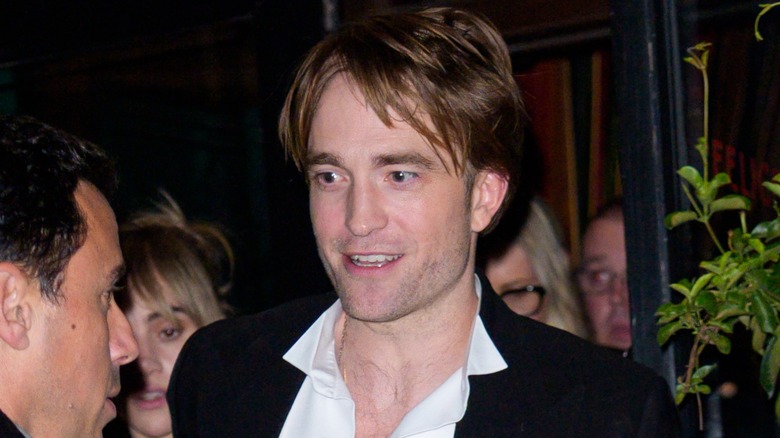 Robert Pattinson leaving an event and looking surprised to talk to someone (2025)