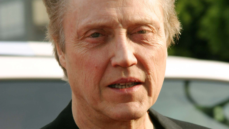 Walken looks on
