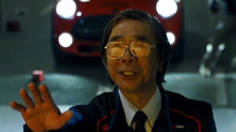 Toru Iwatani raises his hand in "Pixels" (2015)