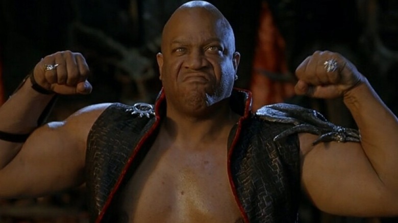 Cassius flexes in "Little Nicky" (2000)