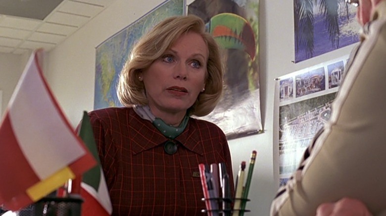 Judy Clayton as a travel agent
