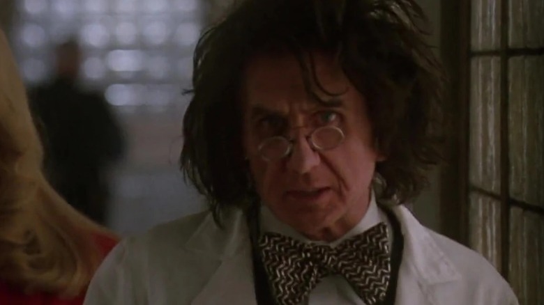 Rene Auberjonois wearing glasses and lab coat