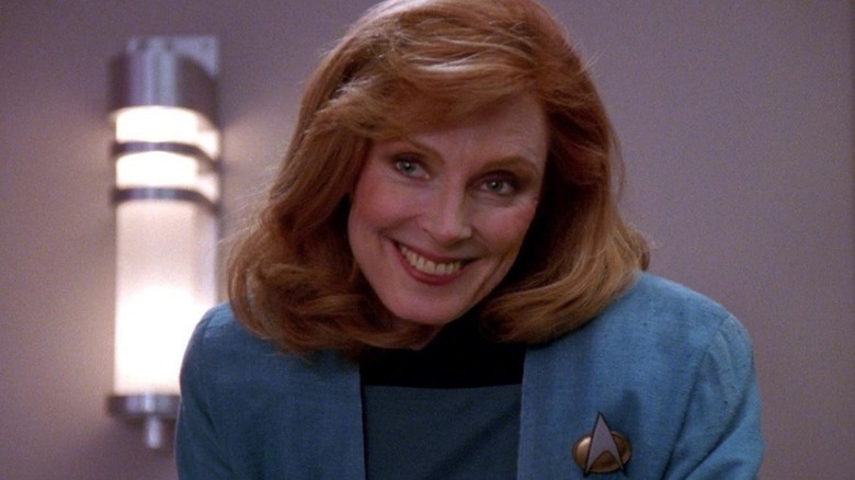 Dr. Beverly Crusher smiling on Star Trek: The Next Generation