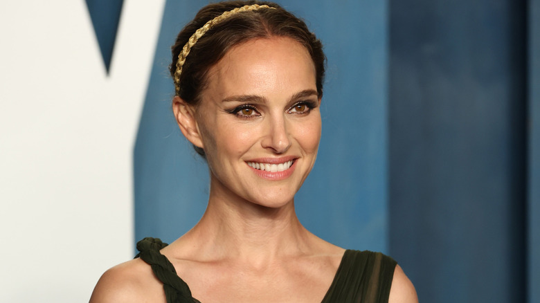 Natalie Portman smiling in black dress
