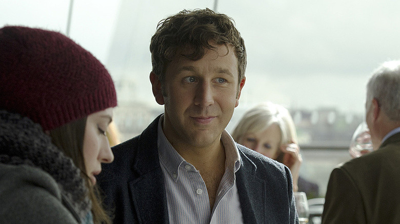 Richard seated next to Darcy at lunch in "Thor: The Dark World" (2013)