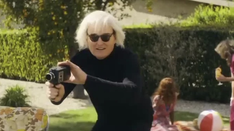Andy Warhol points his camera in "Weird: The Al Yankovic Story" (2022)