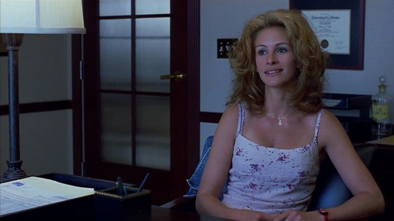 Erin Brockovich sitting in an office in Erin Brockovich