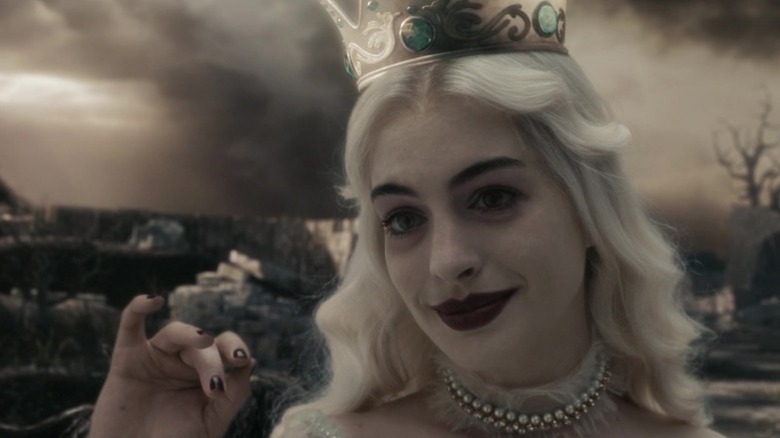 The White Queen smiling faintly