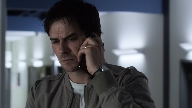 Dr. Swann on the phone looking worried in V-Wars