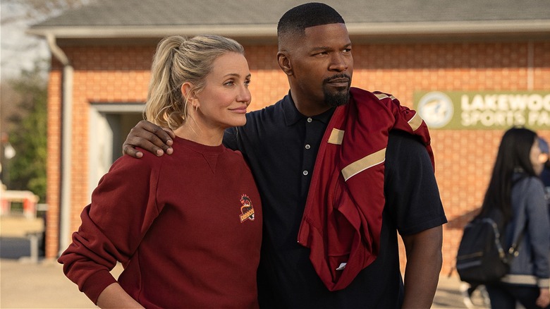 Emily and Matt looking proud outside in Back In Action