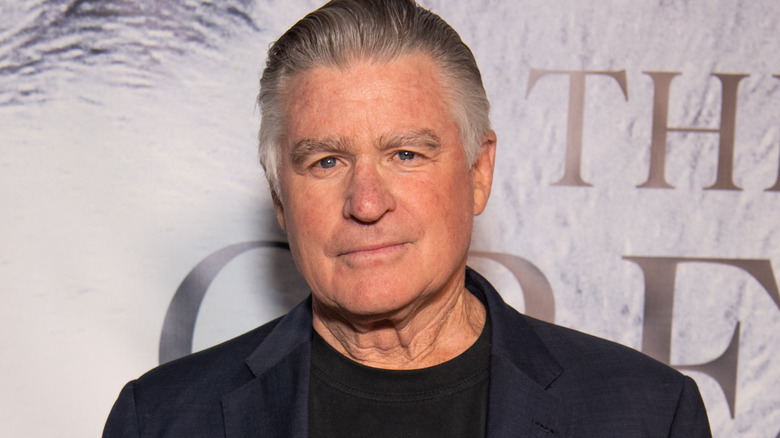 Treat Williams smirking