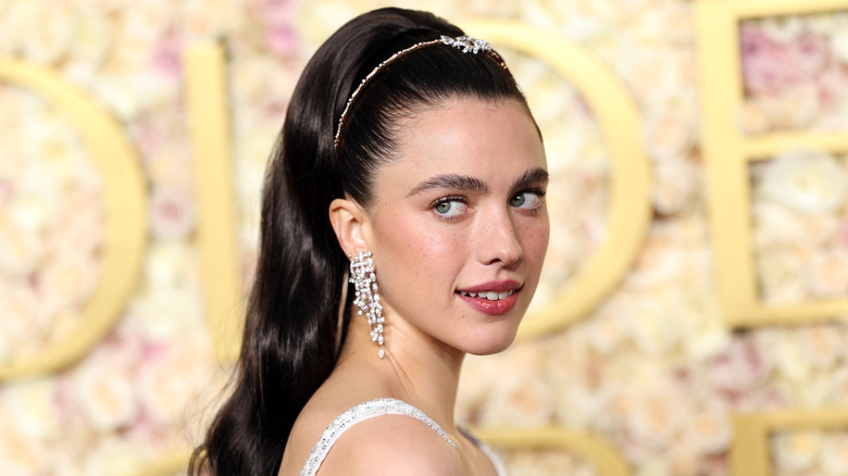 Margaret Qualley looking over her right shoulder
