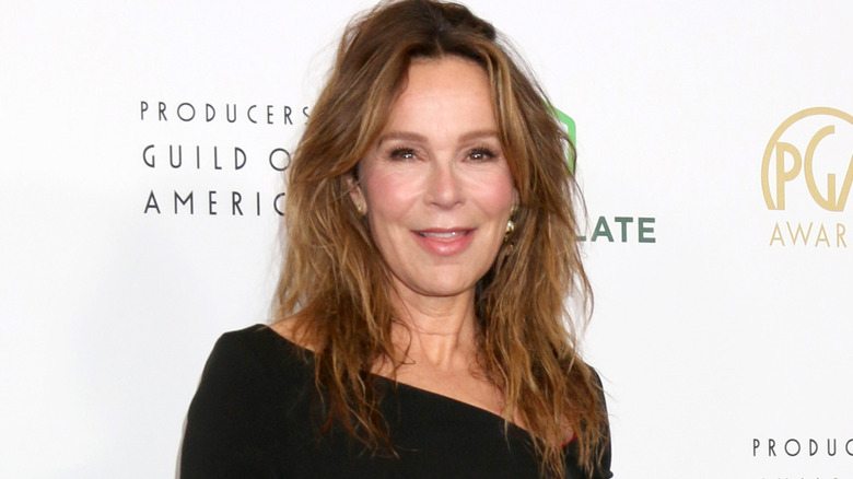 Jennifer Grey smiling in a black dress