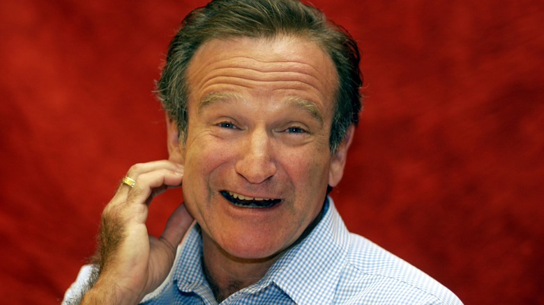 Robin Williams with red background