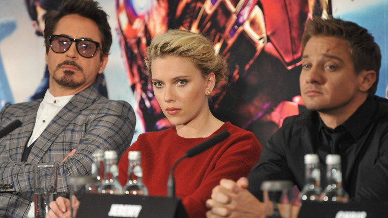 RDJ, Scarlett Johansson, and Jeremy Renner listening at panel