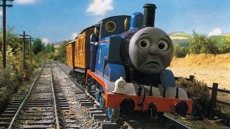 Thomas the Tank Engine looks sad traveling down the tracks of Sodor.
