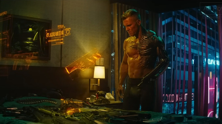 Cable assembles weapon shirtless