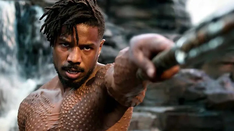 Erik Killmonger points a weapon in "Black Panther"