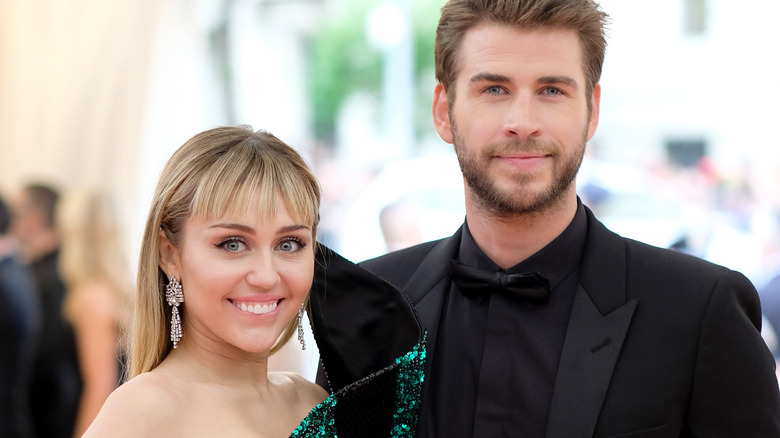 Miley Cyrus and Liam Hemsworth pose together at the 2019 Met Gala