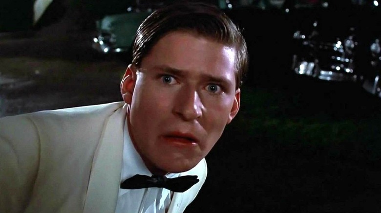 George McFly opens the car doon in "Back to the Future" (1985)
