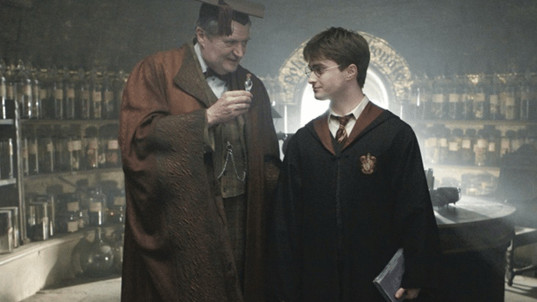 Horace shows Harry a vial in "Harry Potter and the Half-Blood Prince" (2009)