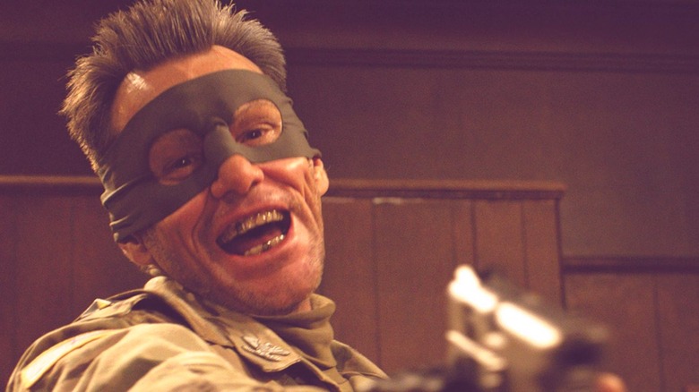Colonel Stars and Stripes points a pistol in "Kick-Ass 2" (2013)