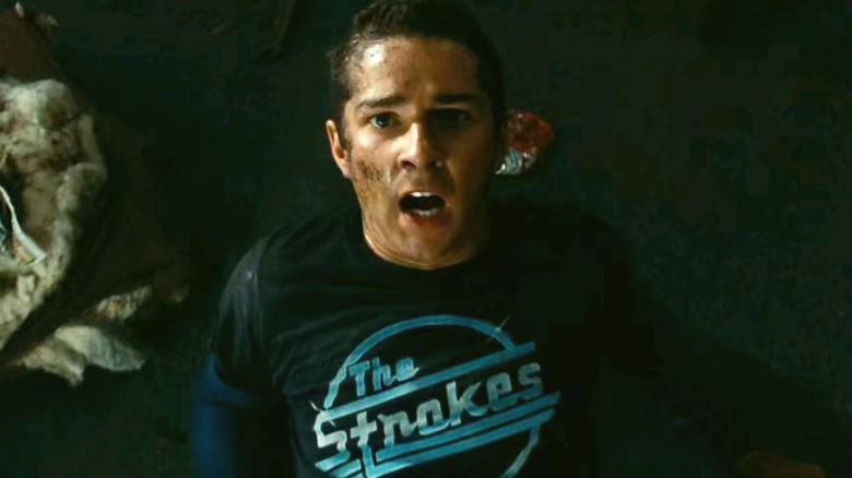 Sam Witcicky falling back in fear in "Transformers" (2009)