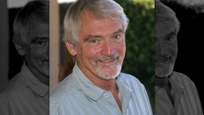 Chris Robinson in a buttoned down blue shirt