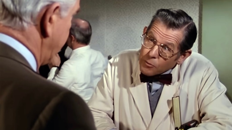 Ted Olsen showing Frank Drebin one of his inventions