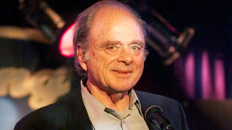 Harris Yulin smiling in front of a microphone
