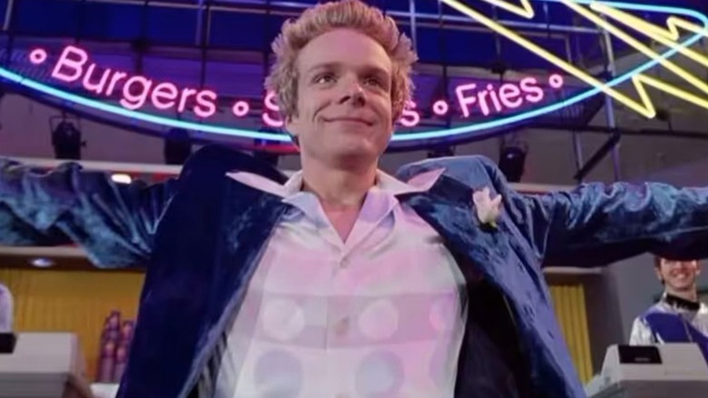 Bozewell triumphantly raising his arms in Good Burger