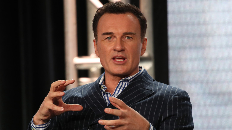 Julian McMahon talking and gesturing