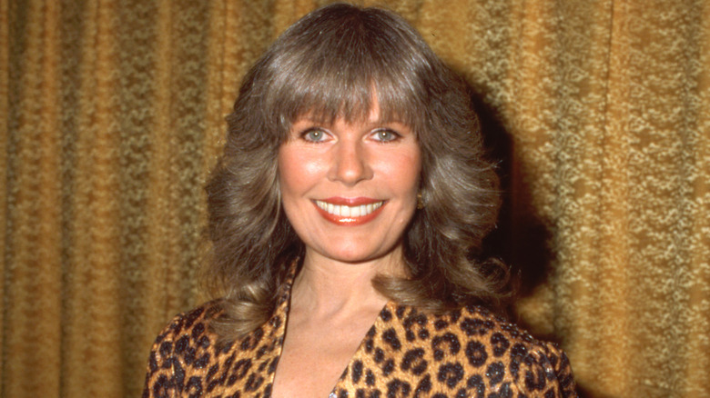 Loretta Swit wearing a cheetah print dress