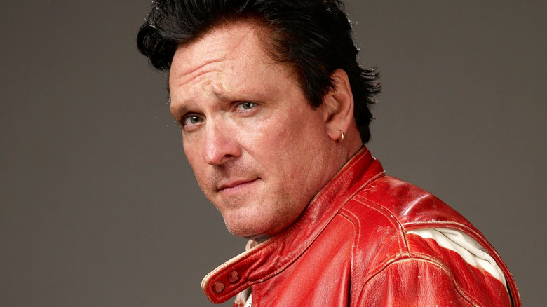 Michael Madson in a red leather jacket