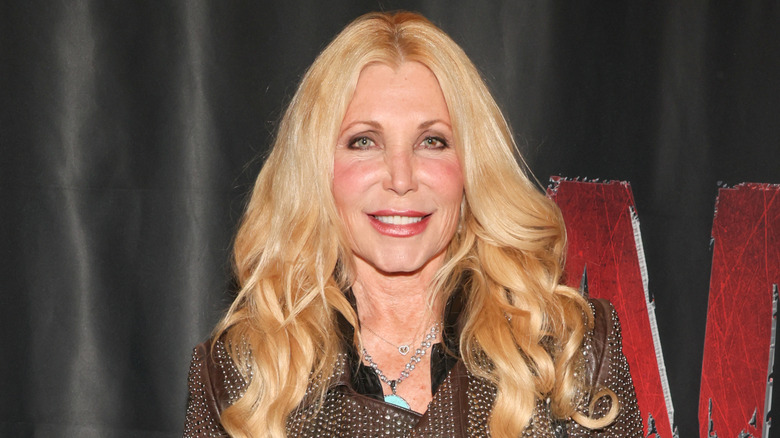 Pamela Bach smiling with curled hair