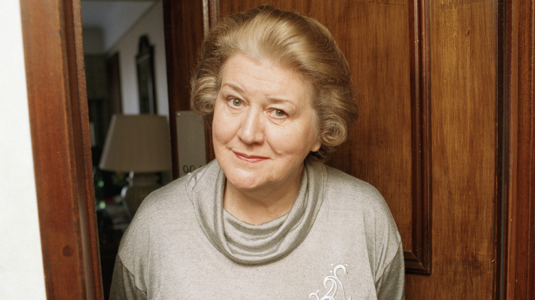 Dame Patricia Routledge in a doorway