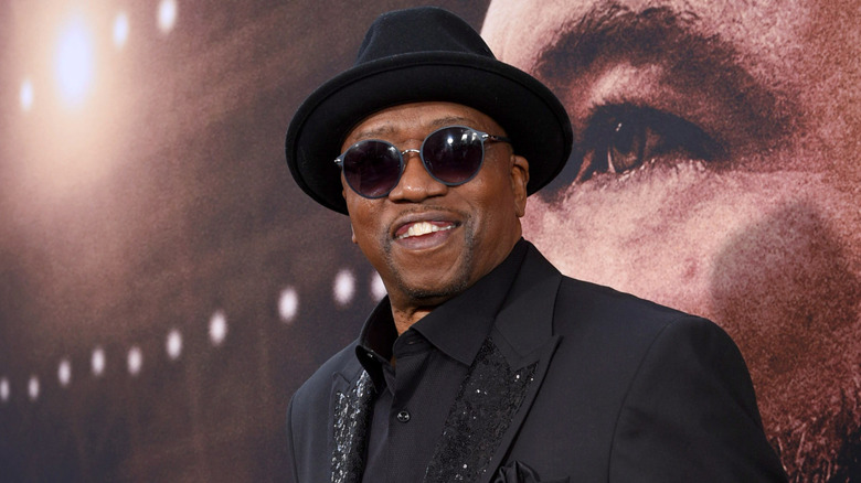 T. K. Carter in a hat and sunglasses