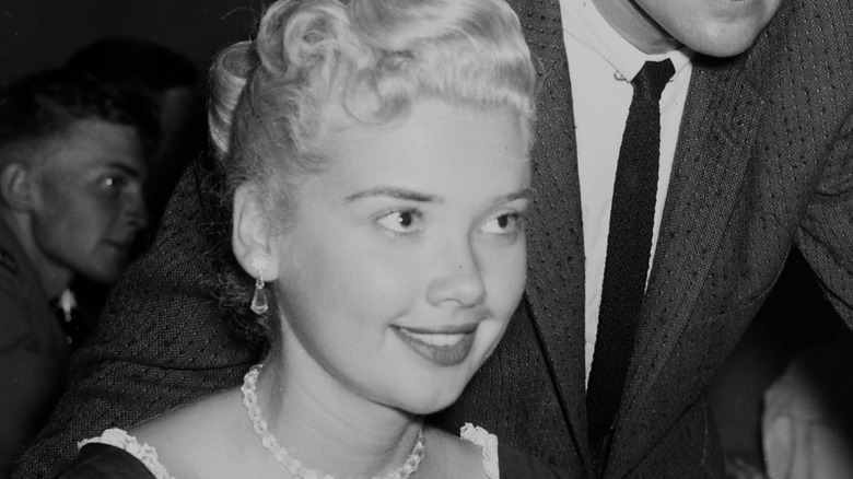Yvonne Lime smiling near a man with a suit