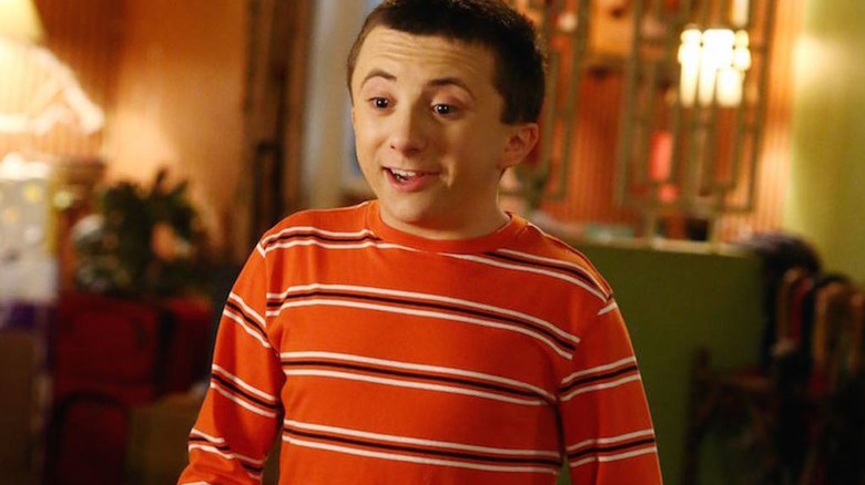 Atticus Shaffer talking and smiling