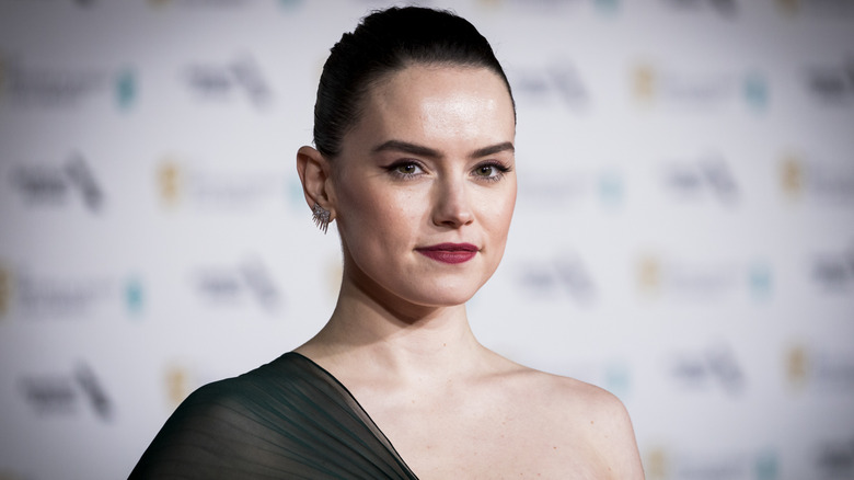 Daisy Ridley half-smiling