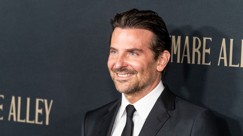 Bradley Cooper smiling on red carpet