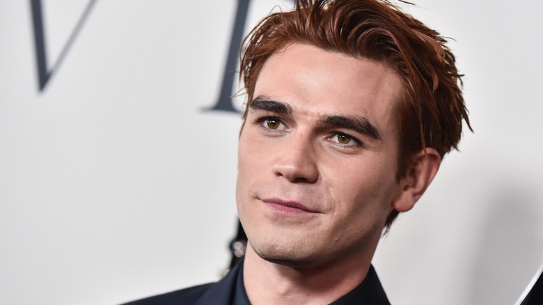 KJ Apa grins