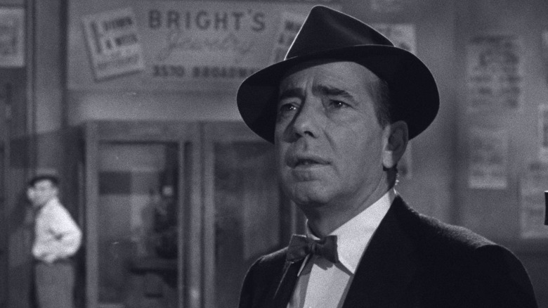 Eddie Willis standing on a street in "The Harder They Fall" (1956)