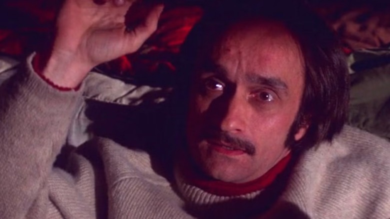 Stanley holding up his arm looking frightened in "The Deer Hunter" (1978)