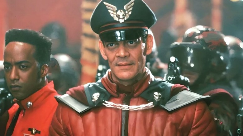 General M. Bison standing among his troops in "Street Fighter" (1994)