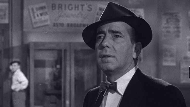 Eddie Willis standing on a street in "The Harder They Fall" (1956)