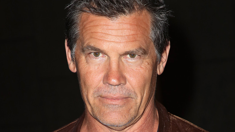 Josh Brolin half-smiles