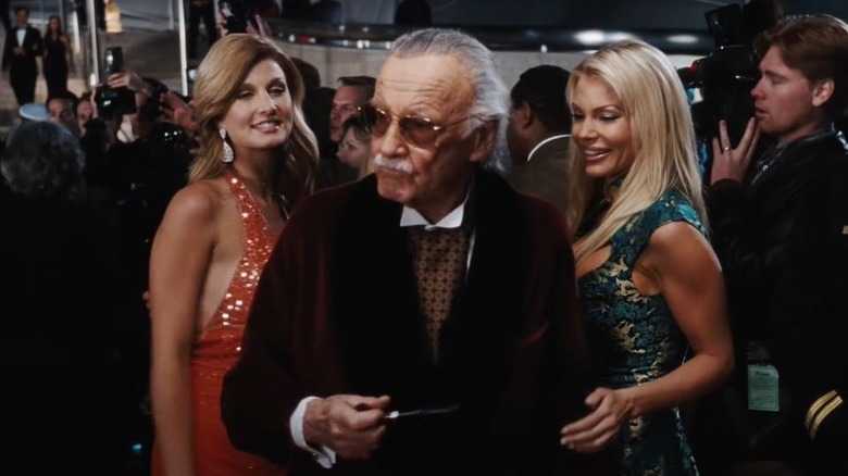 Stan Lee dressed as Hugh Hefner