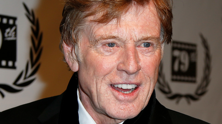 Robert Redford smiling in scarf
